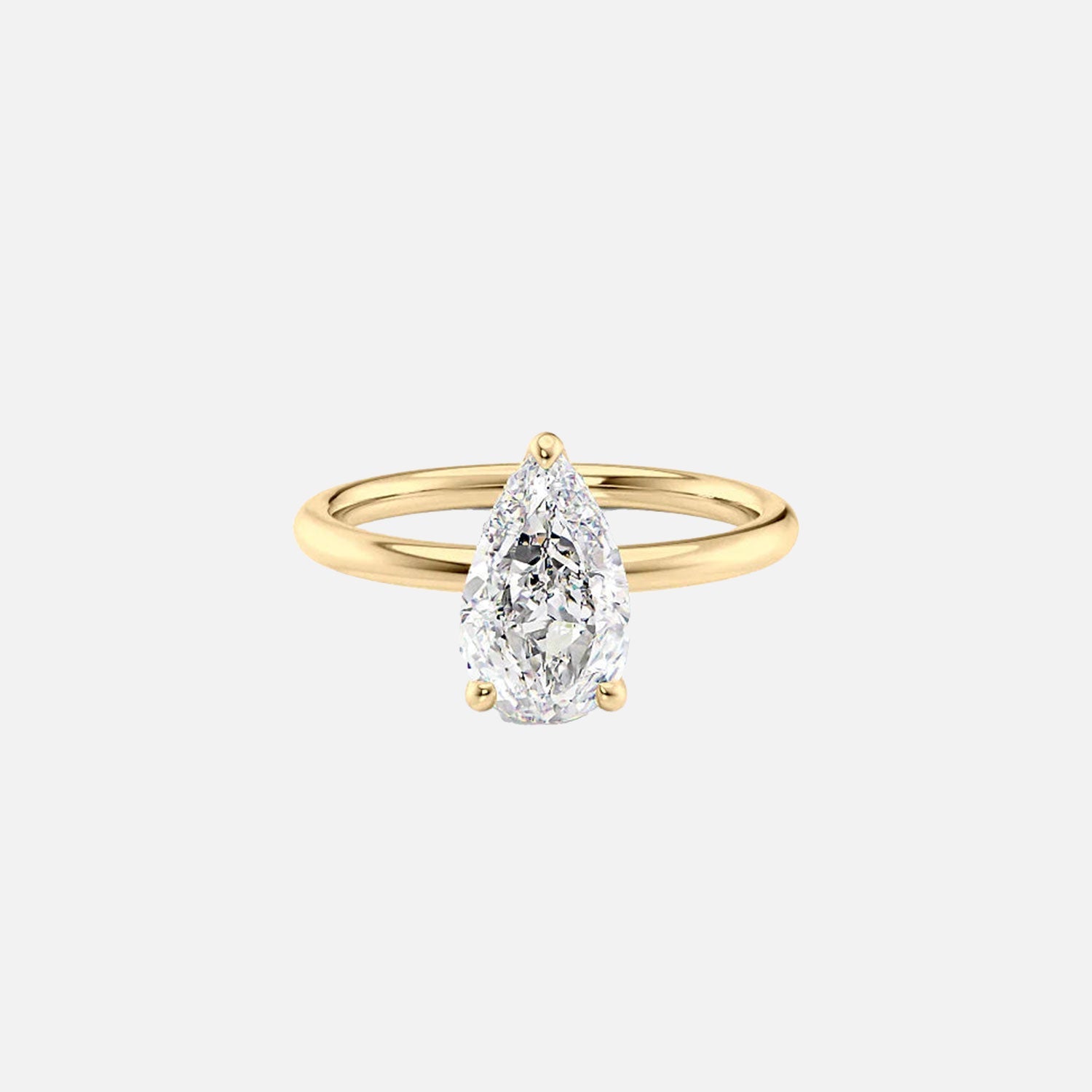 The Solitaire Alex Pear Moissanite Ring 14k Yellow Gold 001