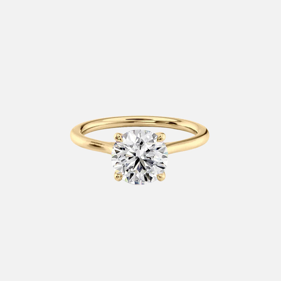  The Solitaire Lexie Round Moissanite Ring 18k Yellow Gold 001