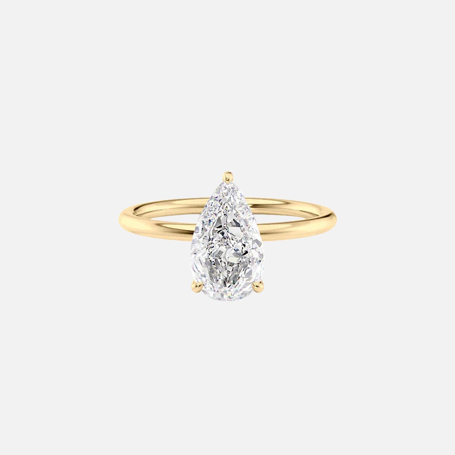 The Solitaire Low Profile Kamellie Pear Moissanite Ring 14k Yellow Gold 001