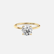  The Solitaire Nelly Round Moissanite Ring 18k Yellow Gold 001