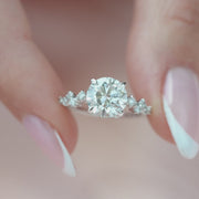 The Hidden Halo Stellar Round Side Stone Moissanite Ring