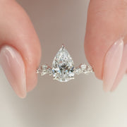 The Hidden Halo Stellar Pear Side Stone Moissanite Ring