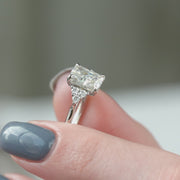 The Side Stone Catharina Radiant Solitaire Moissanite Ring