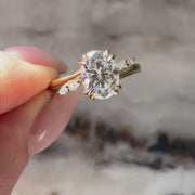 The Side Stone Elara Oval Moissanite Ring